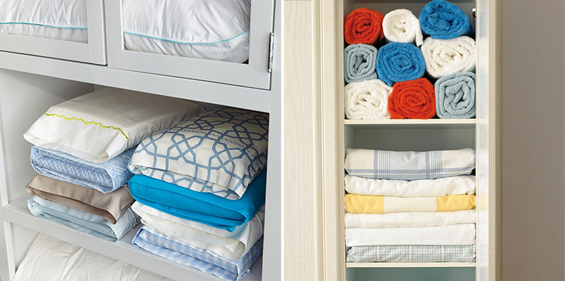 organização de roupas de cama no armário