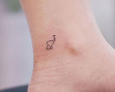 tatuagem atras do braco feminina