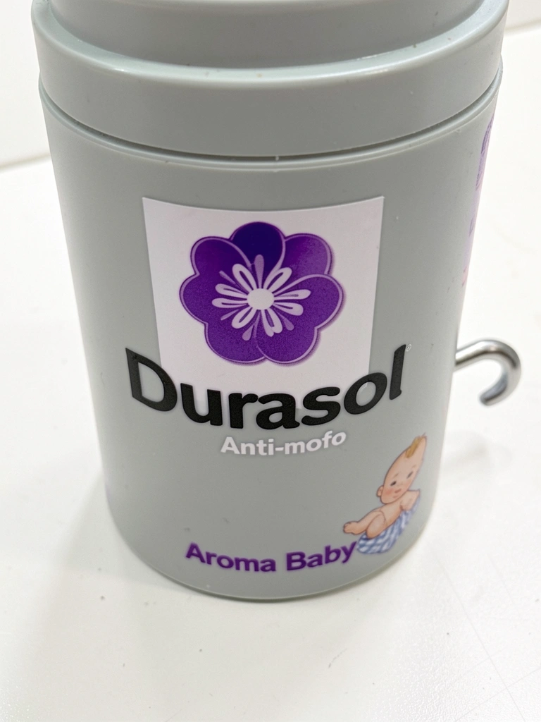 Recipiente de plástico cinza claro da Durasol com logotipo roxo e branco, texto 