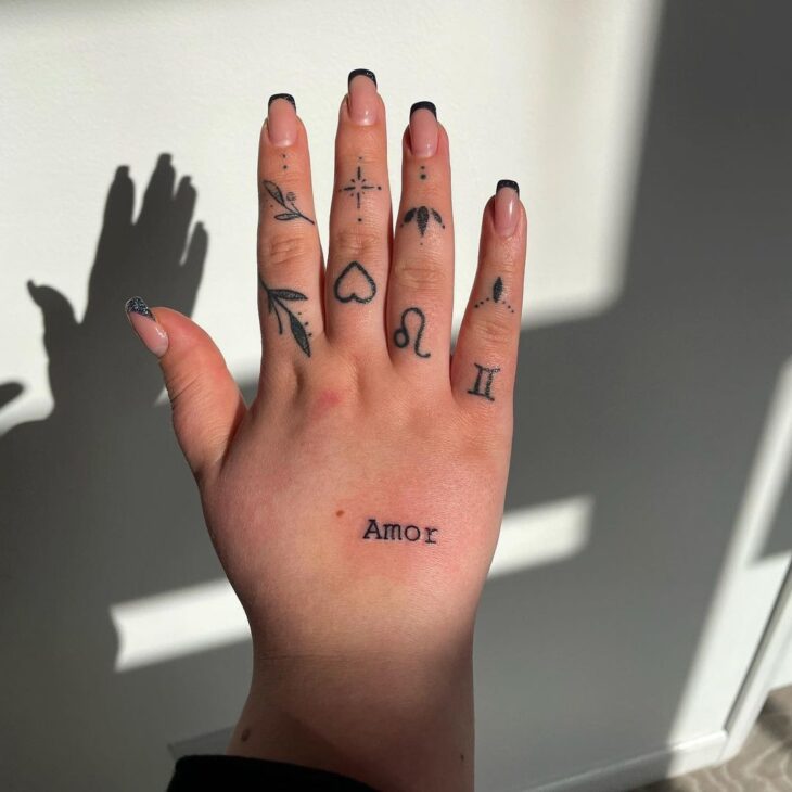 tatuagem de sol na mão mulher